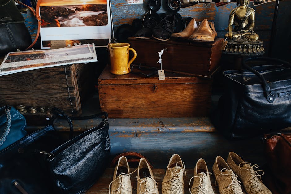 A charming display of vintage shoes, bags, and decor inside a rustic store setting.